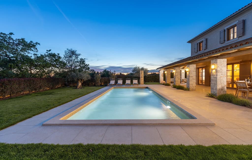 Exterior view of Villa Andrea with private pool, sun loungers, and covered terrace