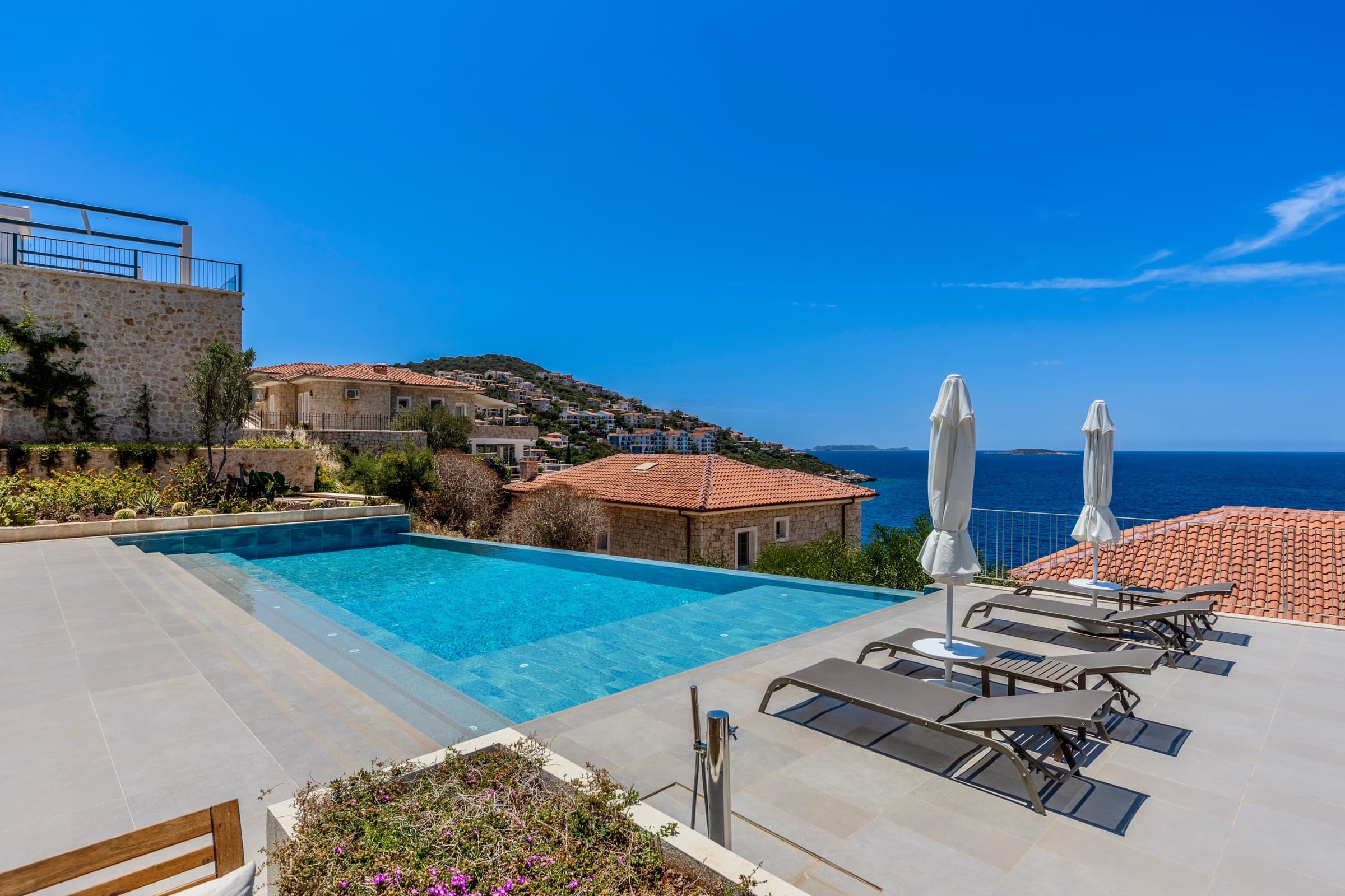 Infinity pool and stone terraces overlooking the Adriatic